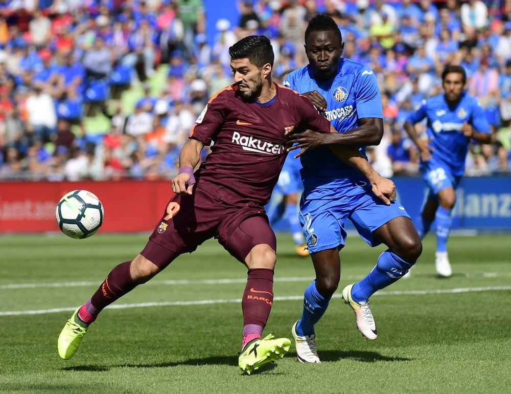 Suarez (trái) có ngày thi đấu cực tệ trước Getafe. Ảnh: Getty Images