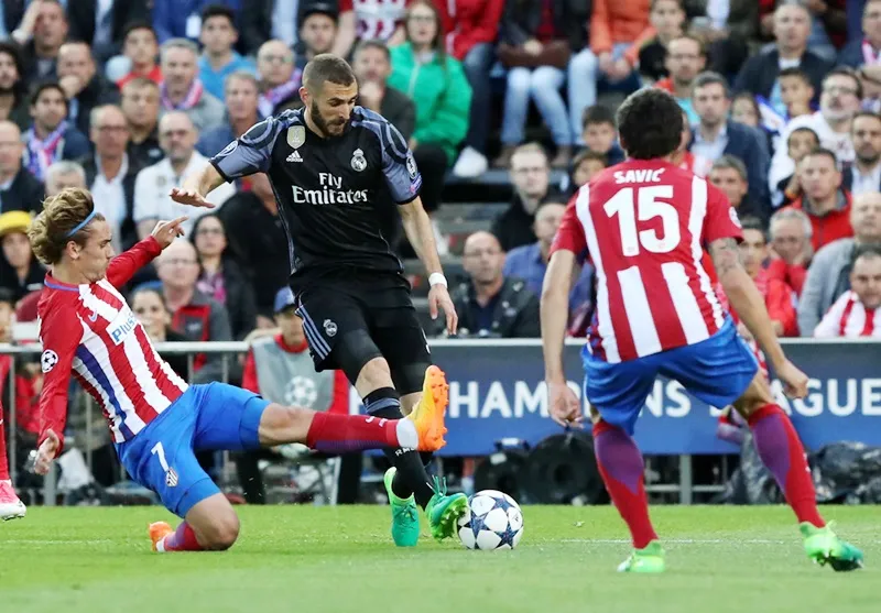Real (đen) hạ quyết tâm lớn vượt qua Atletico. Ảnh: Getty Images