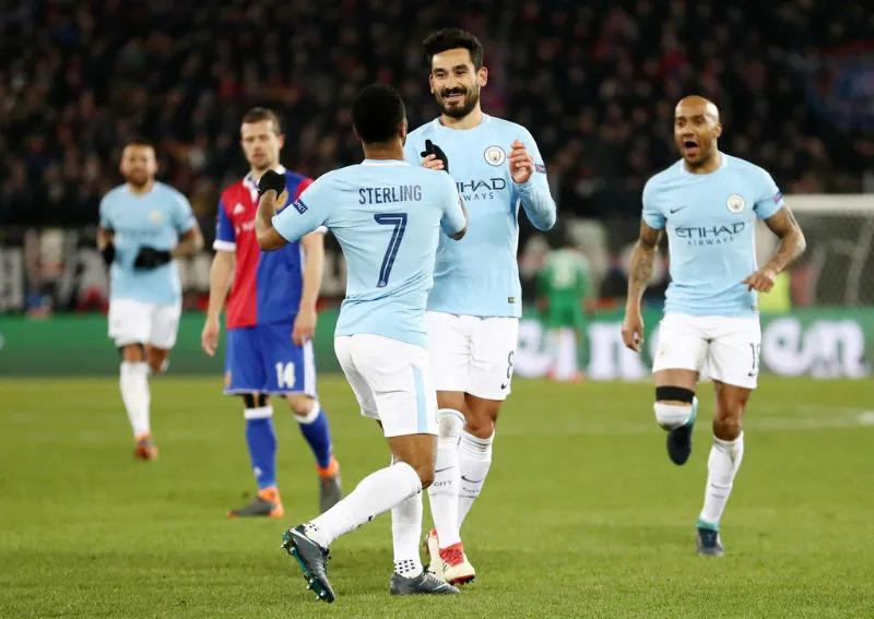 Ilkay Gundogan (giữa) mừng bàn thắng vào lưới Basel ở lượt đi vòng 1/8. Ảnh: Getty Images