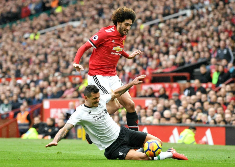 Marouane Fellaini trong lần đối đầu Liverpool hồi tháng 3. Ảnh: Getty Images 