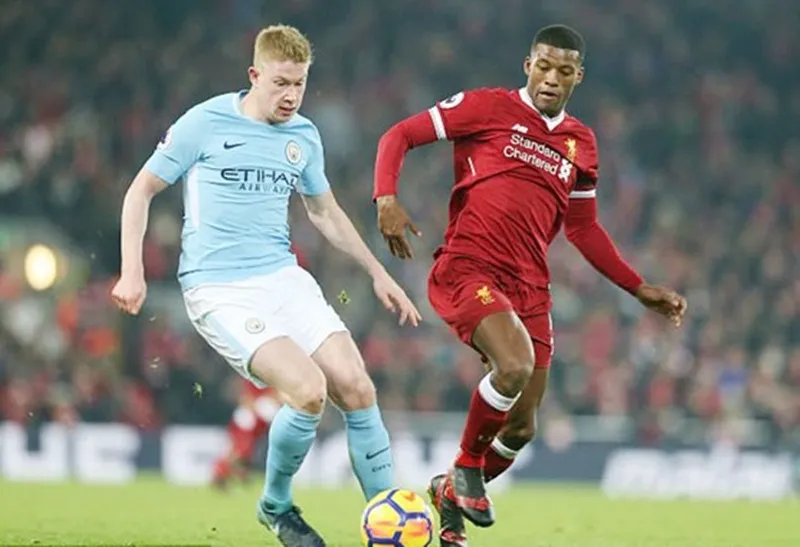 Georginio Wijnaldum (phải) tin tưởng Liverpool sẽ thắng trong cuộc đua với Man.City. Ảnh: Getty Images