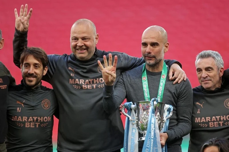 HLV Pep Guardiola hạnh phúc với Cúp Liên đoàn thứ 4 liên tiếp, nhưng sớm đặt mục tiêu cao hơn. Ảnh: Getty Images