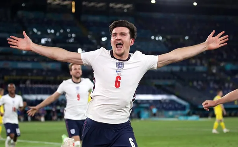 Harry Maguire phấn khích khi ghi bàn trong trận thắng Ukraine 4-0 ở tứ kết. Ảnh: Getty Images