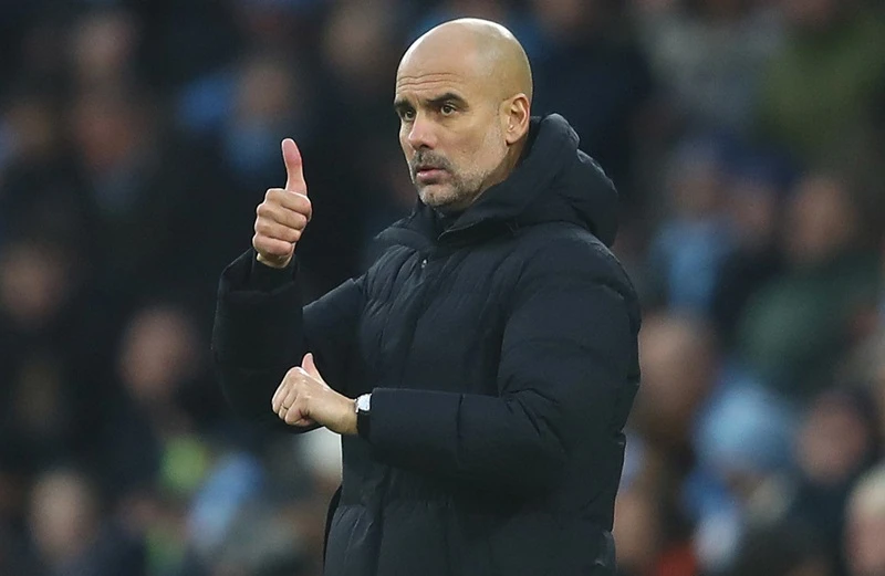 HLV Pep Guardiola khẳng định đang hạnh phúc ở Man.City. Ảnh: Getty Images