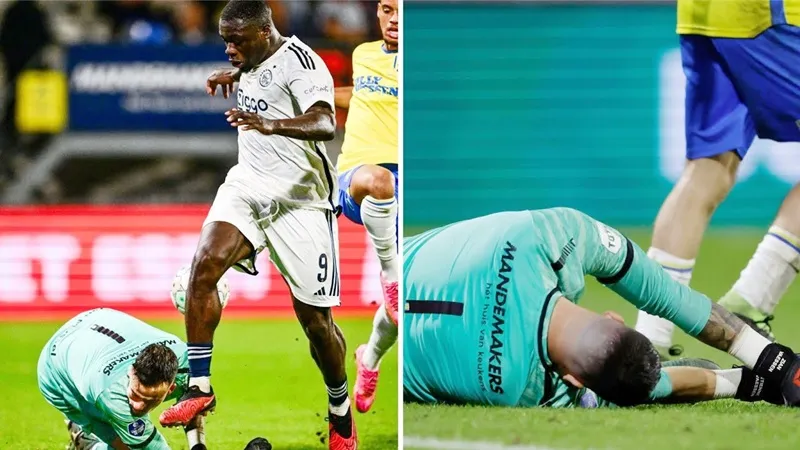 Thủ môn Etienne Vaessen bất động sau pha va chạm kinh hoàng.