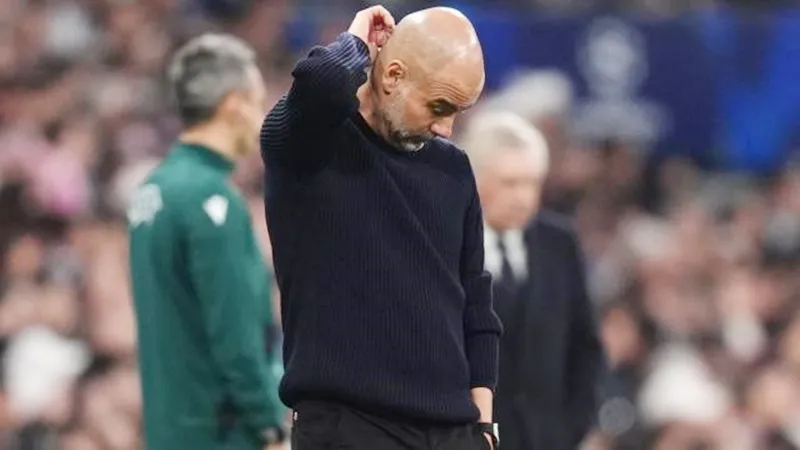 HLV Pep Guardiola không thể tìm ra cách để giữ cho Man.City trụ lại ở Champions League. Pep Guardiola.jpg