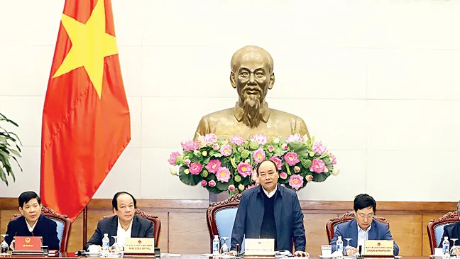 Thủ tướng Nguyễn Xuân Phúc phát biểu chỉ đạo tại Hội nghị tổng kết quan hệ Việt Nam - Lào năm 2017 và triển khai phương hướng hợp tác năm 2018 Ảnh: TTXVN