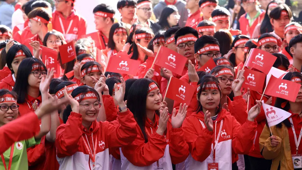 Các tình nguyên viên cùng lan tỏa tinh thần "Tình nguyện vì một tương lai hòa nhập". Ảnh: TTXVN
