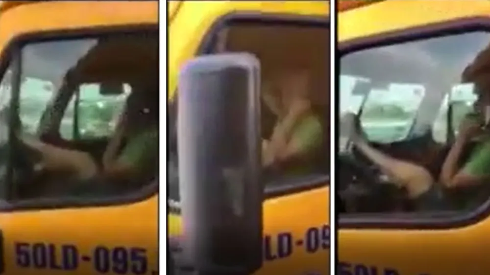 VIDEO: Tài xế xe container tay cầm điện thoại, lái xe bằng chân qua cầu Phú Mỹ ảnh 1