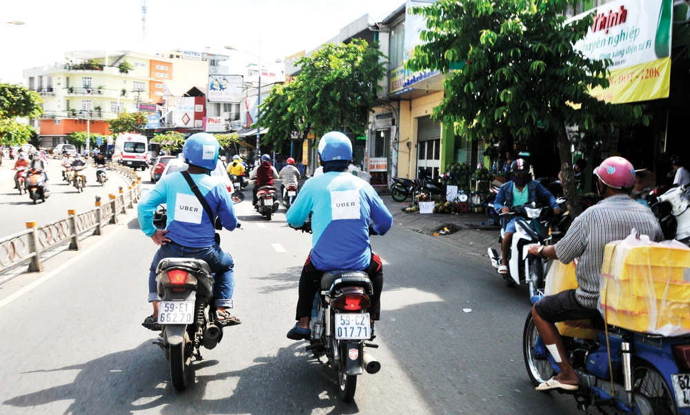 Uber hoạt động tại TPHCM Ảnh: THÀNH TRÍ