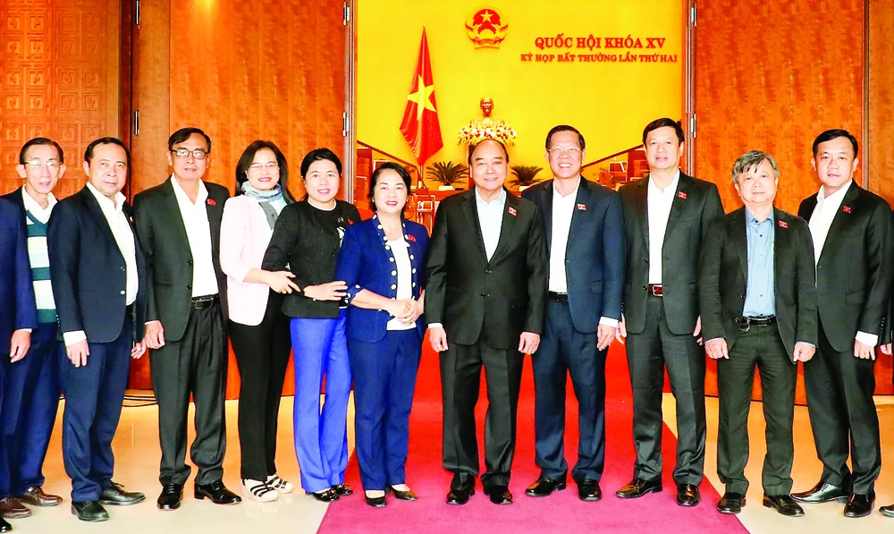 Chủ tịch nước Nguyễn Xuân Phúc và các đại biểu Quốc hội TPHCM tại kỳ họp. Ảnh: QUANG PHÚC Chủ tịch nước Nguyễn Xuân Phúc và các đại biểu Quốc hội TPHCM tại kỳ họp. Ảnh: QUANG PHÚC