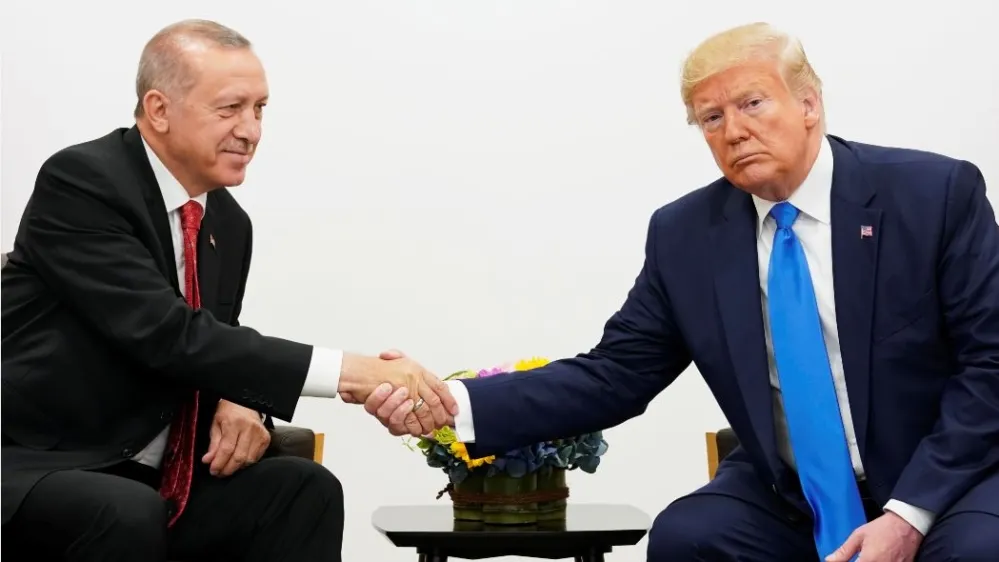 U.S. President Donald Trump shakes hands during a bilateral meeting with Turkey's President Tayyip Erdogan during the G20 leaders summit in Osaka, Japan, June 29, 2019. REUTERS/Kevin Lamarque Trump Edrogan at G20 Osaka Japan