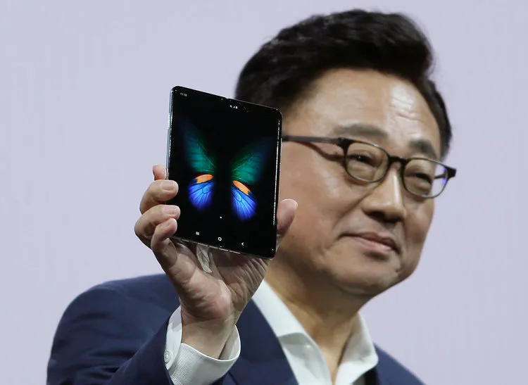 DJ Koh, the president and CEO of IT and mobile communications at Samsung, holding up the new Galaxy Fold smartphone during Samsung's Unpacked event. 3. Samsung debuted the Galaxy Fold, and gave it a name, during its