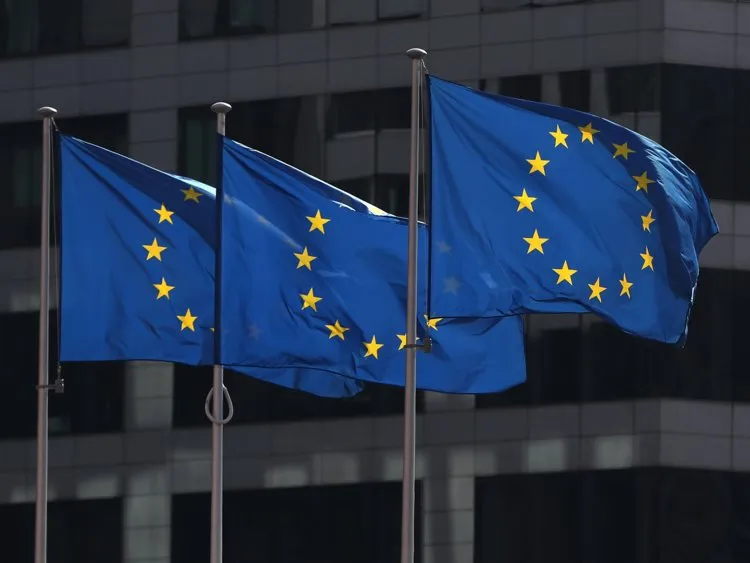 European Union flags fly outside the European Commission headquarters in Brussels 21. Belgium: 15.3% of children with parents in the bottom half ended up in the top quarter.