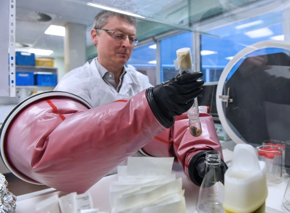 Doctor Philip Supply, Research Director for the CNRS, holds the original test tube containing the strain of Bacillus Calmette Guerin in France, on March 22. Photographer: Denis Charlet /AFP via Getty Images