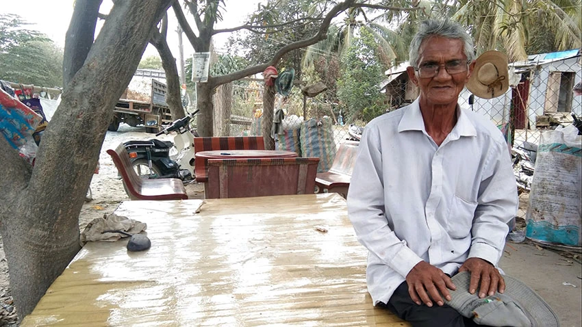 Pa Ven, a village chief in Kampong Speu, Cambodia, says his people can only pay back debts because their children work in factories. (Photo by Shaun Turton) © AP