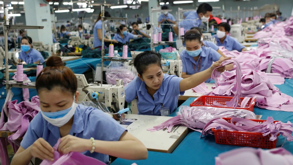 Workers piece together clothes at a factory in Ho Chi Minh City. Vietnam ranks as the world's third-largest apparel exporter. © Reuters