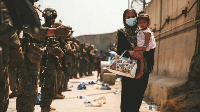 US troops guide an evacuee at Kabul’s international airport. Democrats are increasingly opposed to the use of force overseas in support of US interests © US Marine Corps/Sgt Isaiah Campbell/Reuters