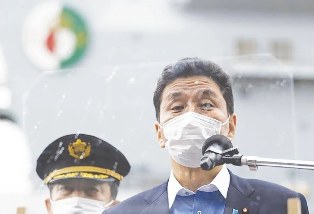 ASIAN POWER In this Sept. 6, 2021 file photo, Japan’s Defense Minister Nobuo Kishi speaks to the members of the media after he inspected the British Royal Navy’s HMS Queen Elizabeth aircraft carrier (back) at the US naval base in Yokosuka, Kanagawa Prefec
