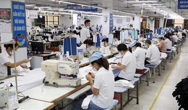 Workers at a garment-textile factory (Illustrative photo: VNA)