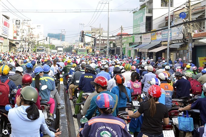 A traffic jam on Huỳnh Tấn Phát Street in HCM City.The city is developing a smart traffic operation centre which will provide the public with information about traffic conditions through electric boards, smartphone applications and radios.— VNA/VNS Photo