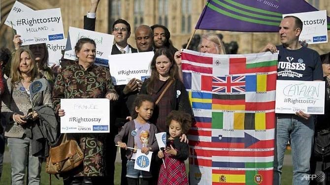 European workers including nurses, social workers and teaching assistants demonstrate outside the Houses of Parliament in London on February 20, before lobbying members of Parliament over their right to remain in the UK. - AFP/VNA Photo 