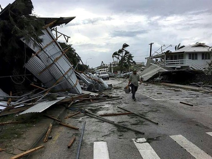 Flooding and damage in Tonga’s capital of Nuku’alofa after Cyclone Gita hit the country. — AFP/VNA Photo