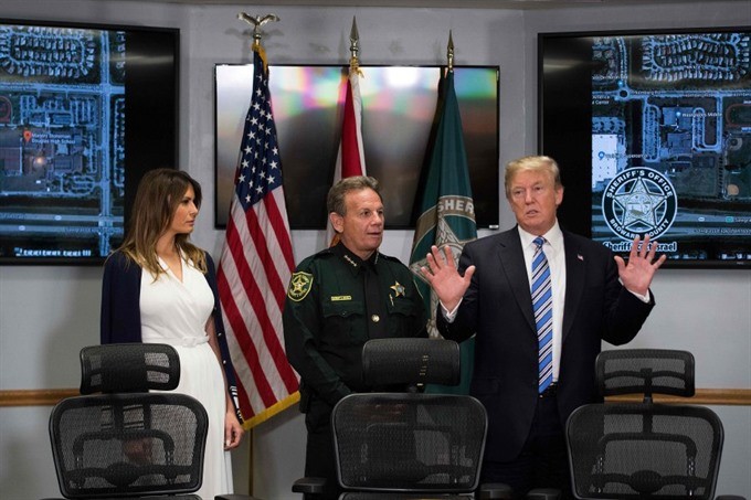 Trump visits Florida shooting survivors, FBI admits it missed tip 