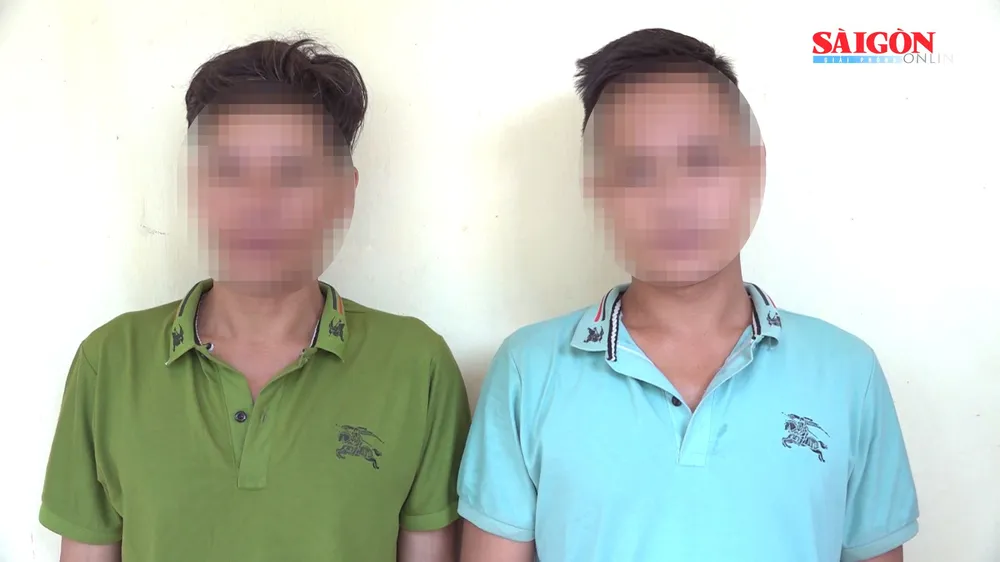Hồ Văn Long và Hồ Văn Lũ tại cơ quan công an