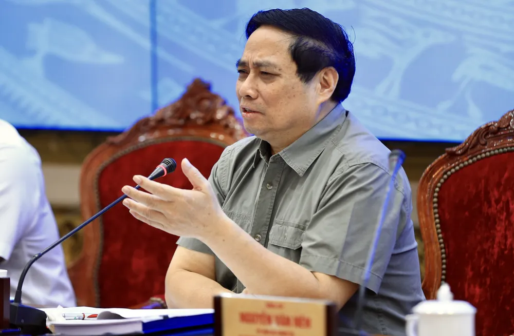 Thủ tướng Phạm Minh Chính trao đổi tại hội nghị. Ảnh: DŨNG PHƯƠNG