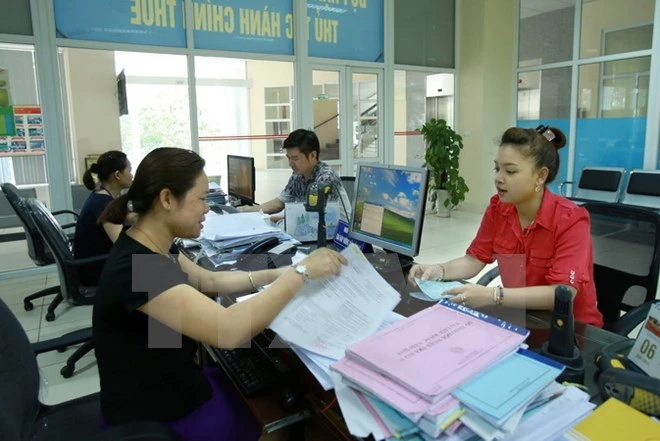 Nâng cao chất lượng công tác tuyên truyền, hỗ trợ người nộp thuế. (Ảnh: Hoàng Hùng/TTXVN)