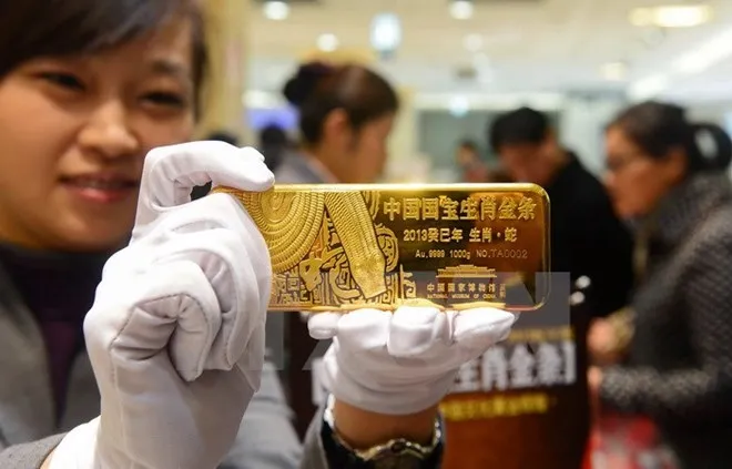 Giá vàng thế giới giảm xuống dưới mức 1.300 USD mỗi ounce