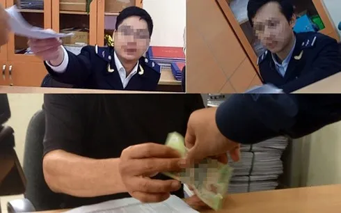 Các cán bộ hải quan dính nghi án nhận lót tay (Ảnh cắt từ clip của Báo Lao Động).