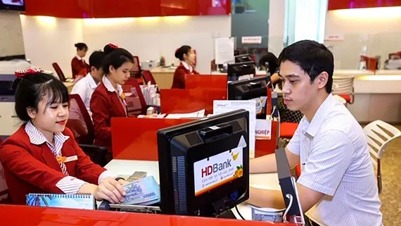 Siết cho vay ngoại tệ không ảnh hưởng đến lãi suất cho vay VND. Ảnh: HUY ANH