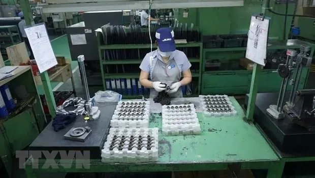 Sản xuất máy may công nghiệp và các thành phần mài tại Công ty Juki Việt Nam. (Ảnh minh họa: TTXVN)