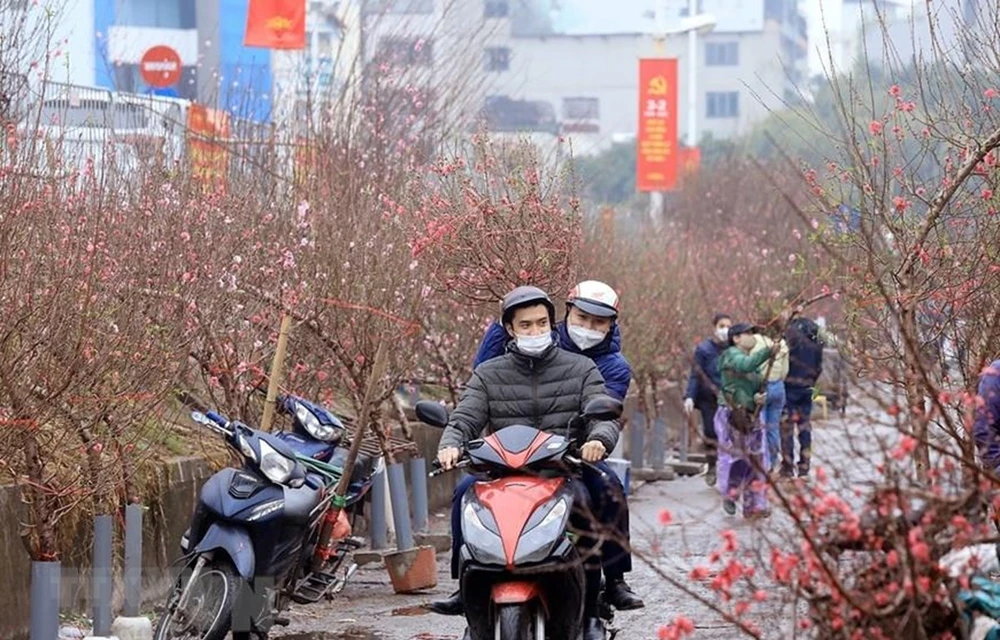 Bộ Lao động-Thương binh và Xã hội đưa ra 2 phương án nghỉ Tết Nguyên đán năm 2023 với số ngày nghỉ có thể kéo dài 7 ngày hoặc 9 ngày. (Ảnh minh hoạ: Tuấn Anh/TTXVN)