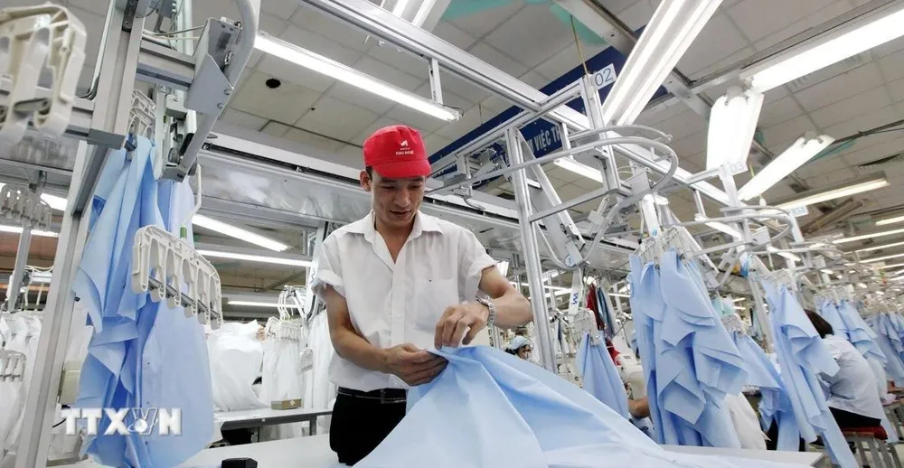 Sản xuất ngành dệt may xuất khẩu sang châu Âu. (Ảnh: Đỗ Phương Anh/TTXVN) 