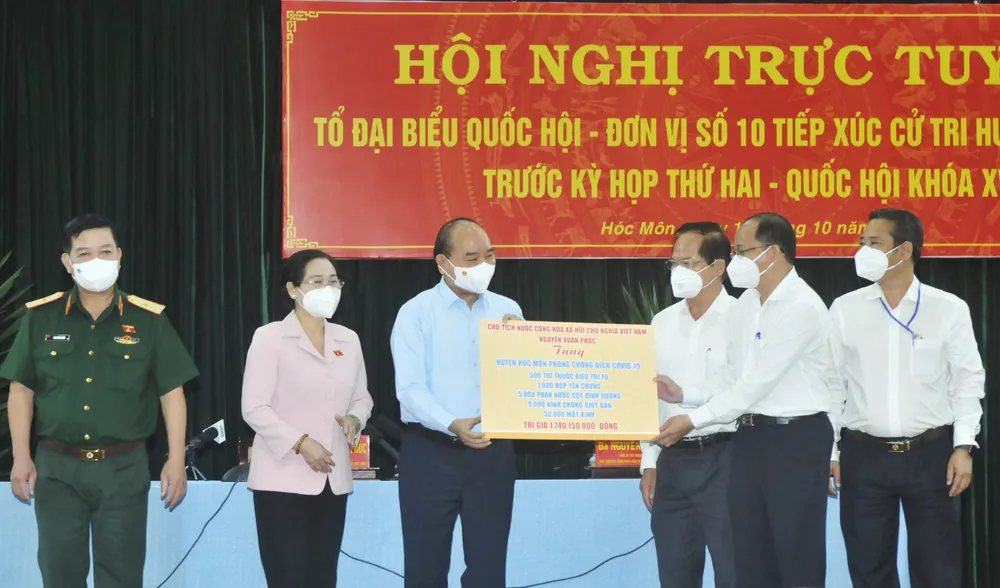 Chủ tịch nước Nguyễn Xuân Phúc: Sớm đưa huyện Hóc Môn thành đô thị phía Tây của TPHCM ảnh 5