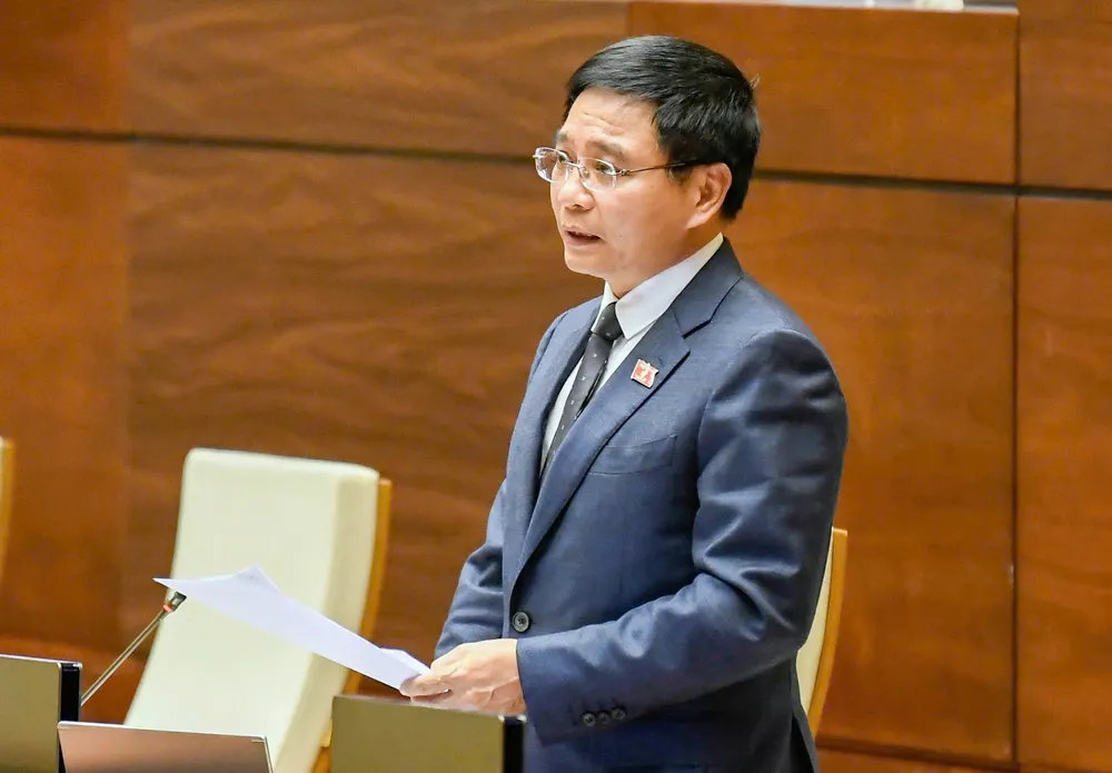 Bộ trưởng Bộ Tài chính Nguyễn Văn Thắng phát biểu giải trình, làm rõ một số vấn đề đại biểu Quốc hội nêu, chiều 9-12. Ảnh: VIẾT CHUNG 