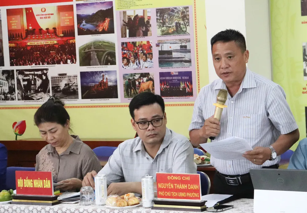 សមមិត្ត Nguyen Thanh Danh រាយការណ៍នៅកិច្ចប្រជុំ។ z6852009975354_4dbe07a4978d224bc05a5851817c91bb.jpg