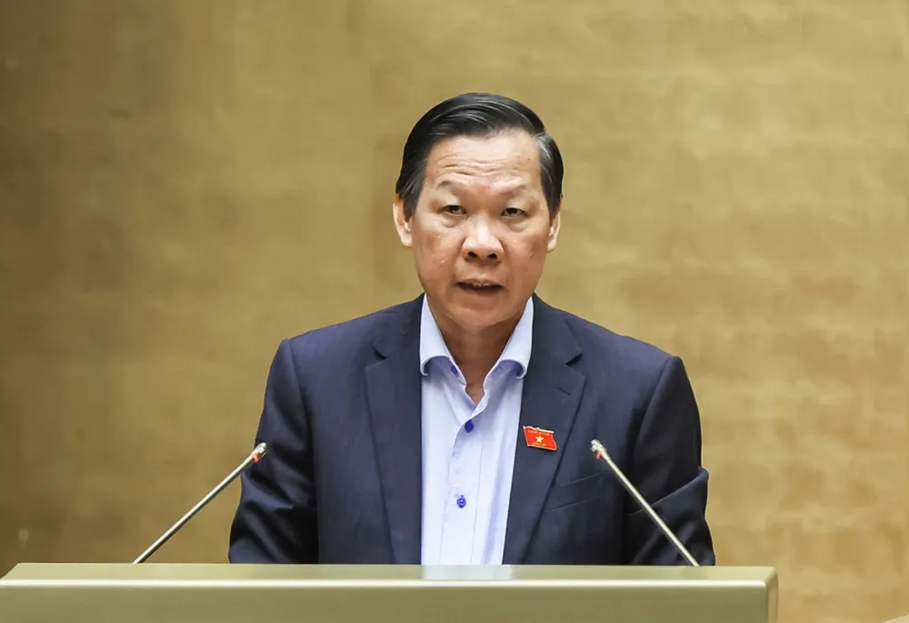 Chủ nhiệm Ủy ban Kinh tế và Tài chính của Quốc hội Phan Văn Mãi trình bày báo cáo thẩm tra về chủ trương đầu tư Dự án đầu tư xây dựng đường Vành đai 4 TPHCM, chiều 12-6. Ảnh: QUANG PHÚC z6697769808623_b0c9252f1e5d2bd19edbe9bb477d631a.jpg