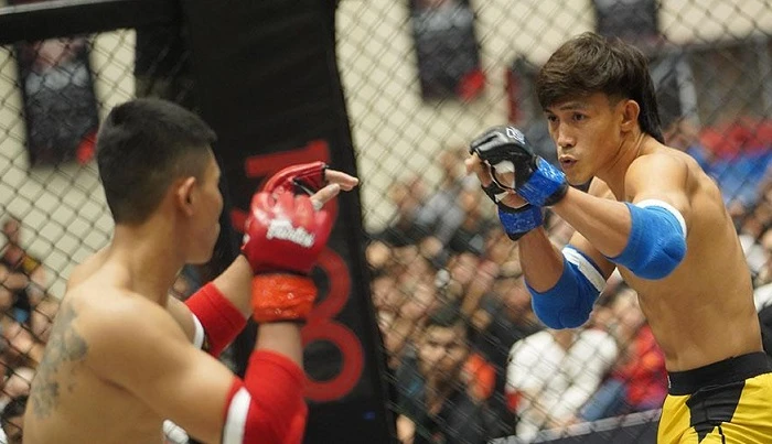 Nguyễn Trần Duy Nhất là võ sĩ tham dự giải MMA lần này và đã lọt vào tứ kết hạng cân. Ảnh: VMMAF