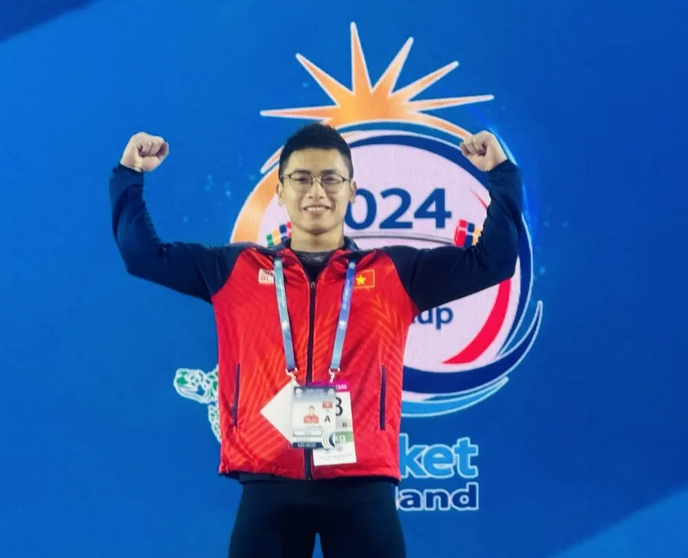 Trịnh Văn Vinh đã có tấm vé Olympic 2024 đầy quan trọng cho cử tạ Việt Nam. Ảnh: H.HÙNG
