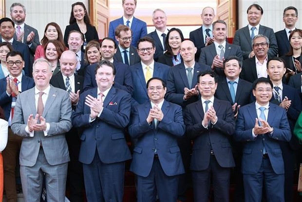 PM Pham Minh Chinh and leaders of US companies. (Photo: VNA)