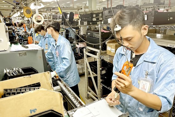 Workers at Datalogic factory produce electrical devices in the Saigon High-Tech Park. Workers at Datalogic factory produce electrical devices in the Saigon High-Tech Park.