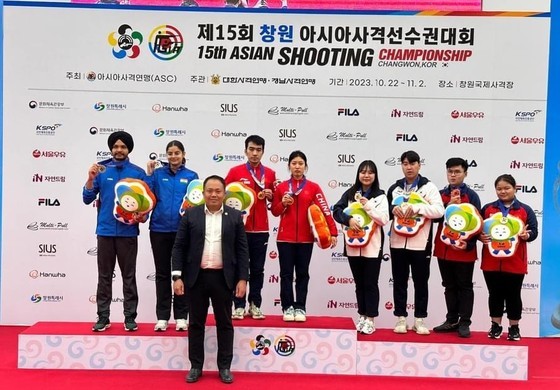 The shooters receive medals for the event on October 25. The shooters receive medals for the event on October 25.