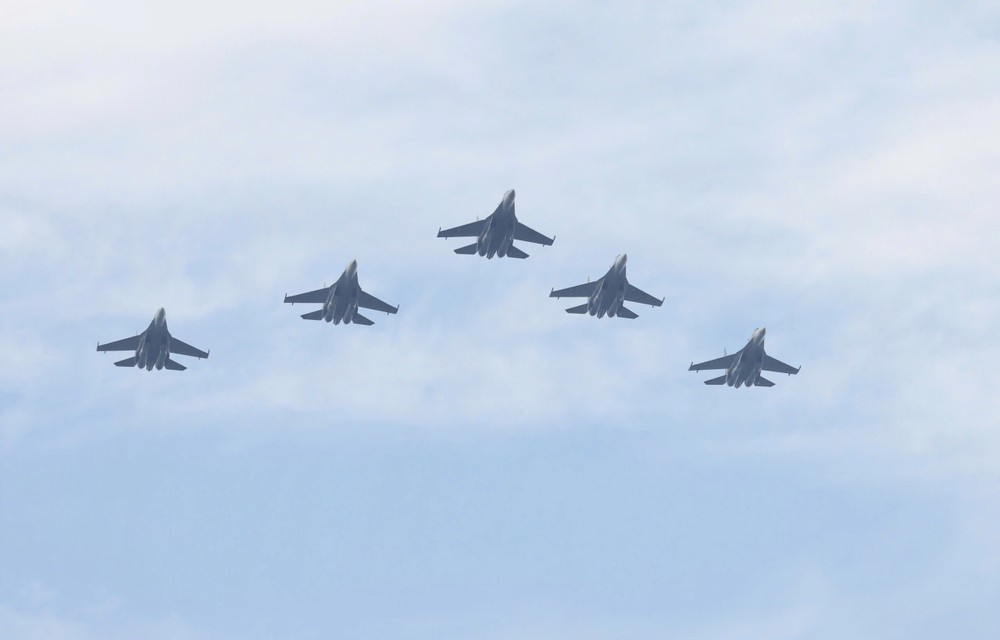 A formation of SU-30MK2 fighter jets performs an aerial display during the comprehensive rehearsal for the A80 grand celebration. 35128f8b79cff291abde-4626-5687.jpg.jpg