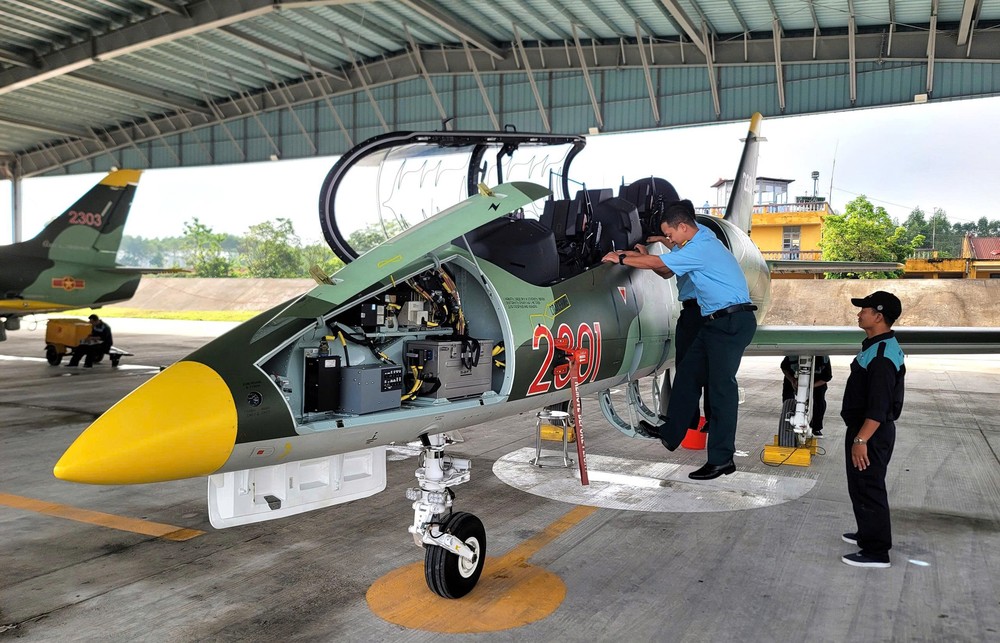Technicians conduct safety checks on L-39NG aircraft before takeoff for their mission. z6965880451543-2ecbab8f1057c299551be2968aeb7f74-8389-5609.jpg.jpg