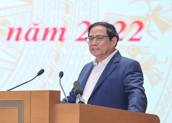Prime Minister Pham Minh Chinh is delivering his speech at the meeting. (Photo: SGGP)