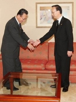 Kim Yang-Gon (left), North Korea's Department Director of the Central Committee of the Workers' Party shakes hands with SKorea's Unification Minister Hyun In-Taek before their meeting in Seoul. Kim Yang-Gon (left), North Korea's Department Director of the Central Committee of the Workers' Party shakes hands with SKorea's Unification Minister Hyun In-Taek before their meeting in Seoul.